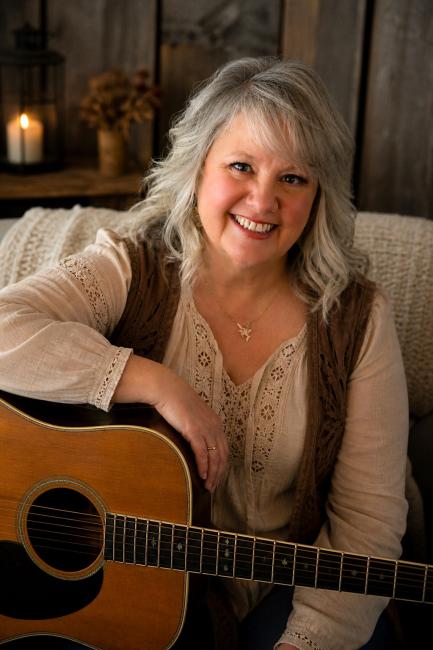 Photo of Nancy Carey Johnson with Guitar